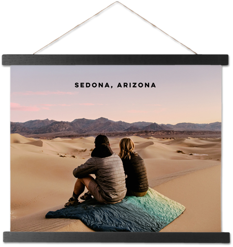 Canvas wall hanging as a way to display travel photos.